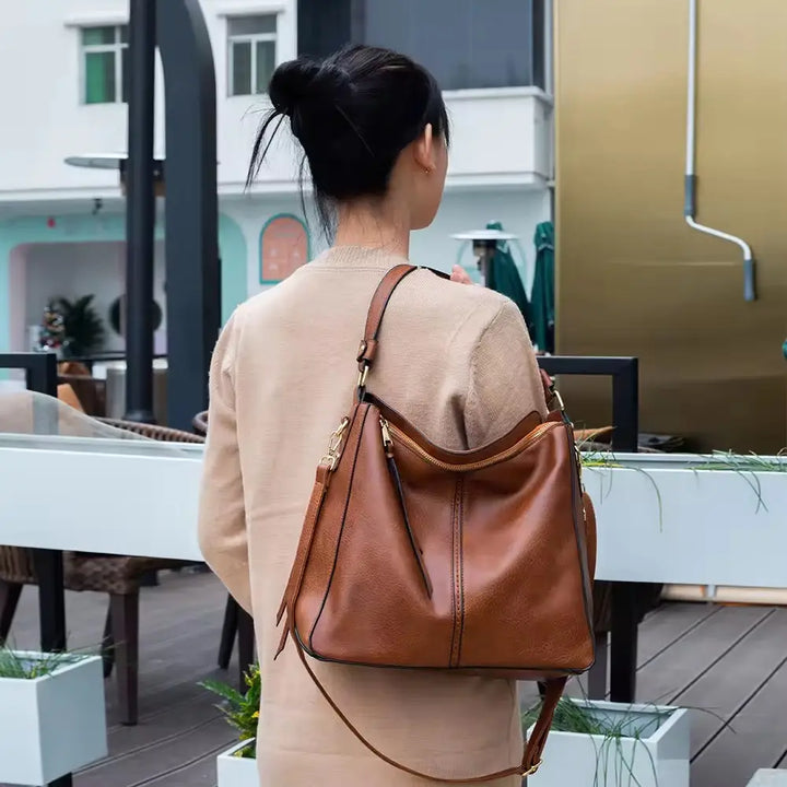 Bolso de cuero con protección antirrobo + Monedero Pouch GRATIS